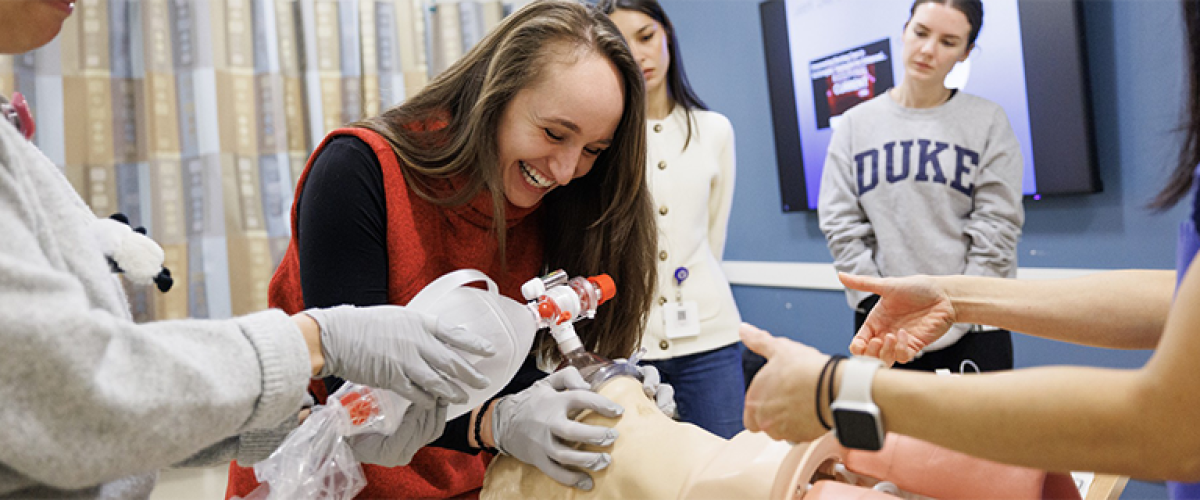 Students practicing ventilating on a mannequin.