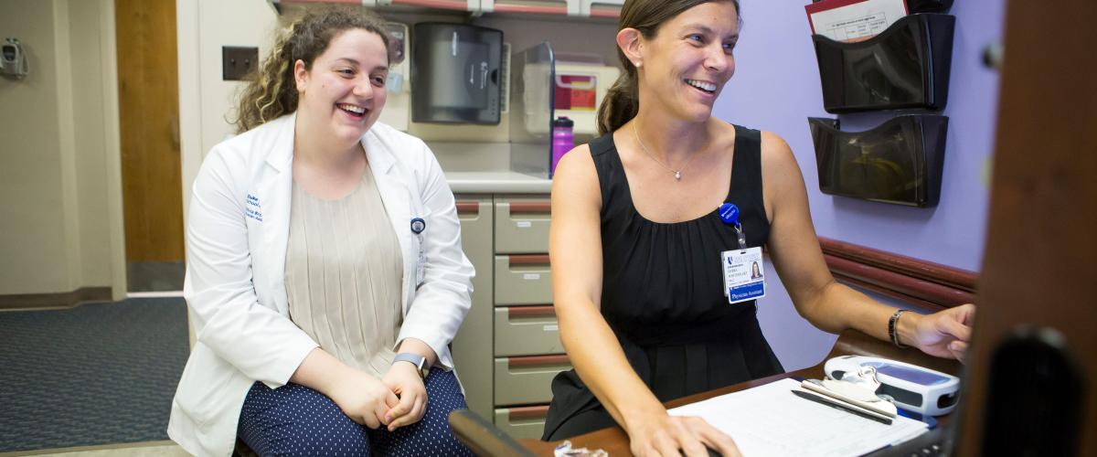 Preceptor talking with student