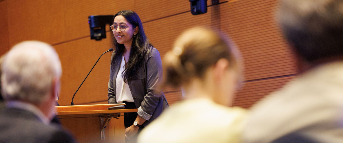 Zoya Surani presenting her research at the 2026 Medical Symposium.