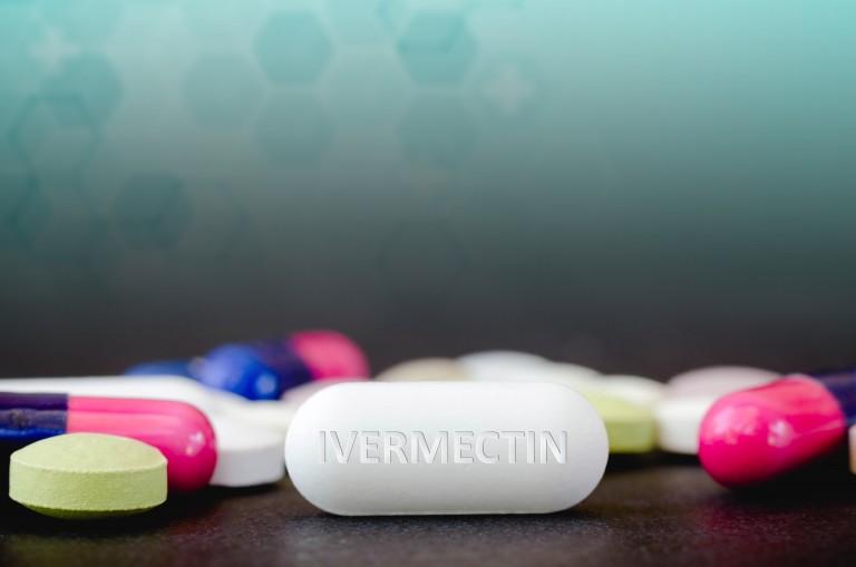 colorful pills and tablets on a surface. 