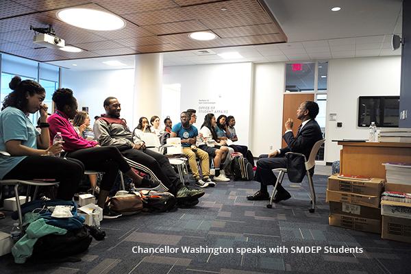Chancellor Washington speaks with SMDEP Students