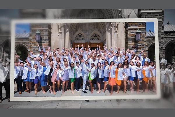 Doctor of Physical Therapy Class of 2022 in their white coats in front of the Duke Chapel.