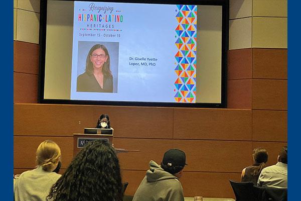 Dr. Lopez speaking in the Great Hall