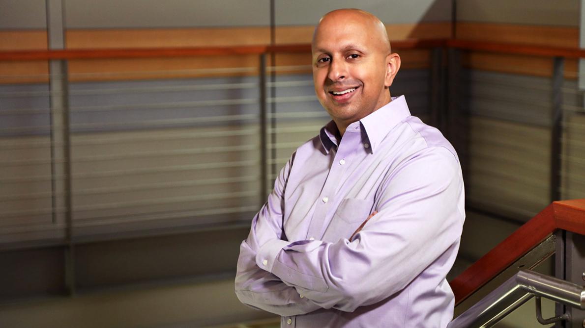 man standing on stairs with arms crossed