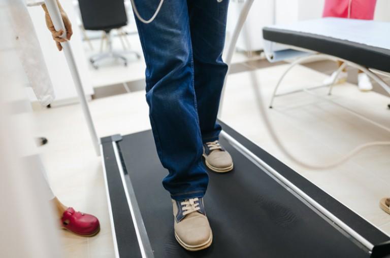 Feet of a person on a treadmill 