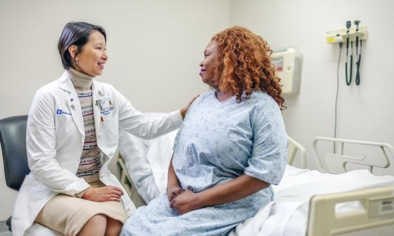 Provider interviewing patient in clinic