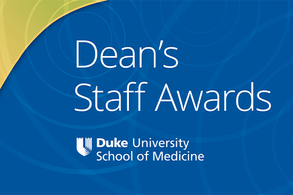 Dean's staff Award over SoM Logo