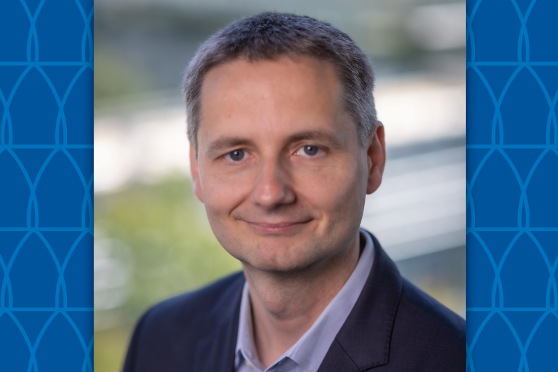 headshot of man on graphic background