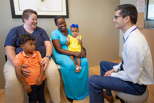 Clayton Alphonso, MD, with a family.