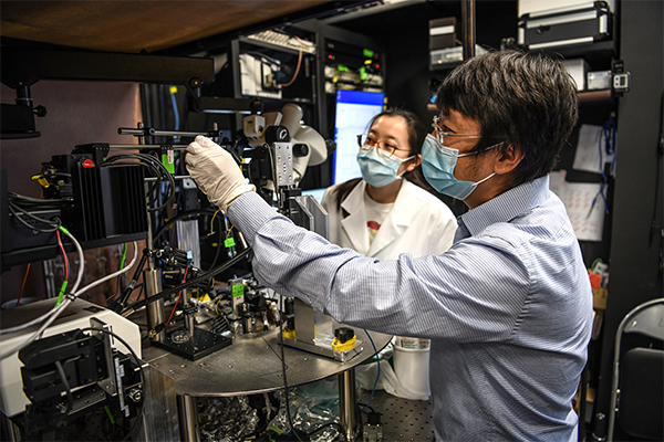 Nuo Li, PhD in his lab 