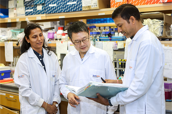 Paul Yen, PhD in the lab with his associates