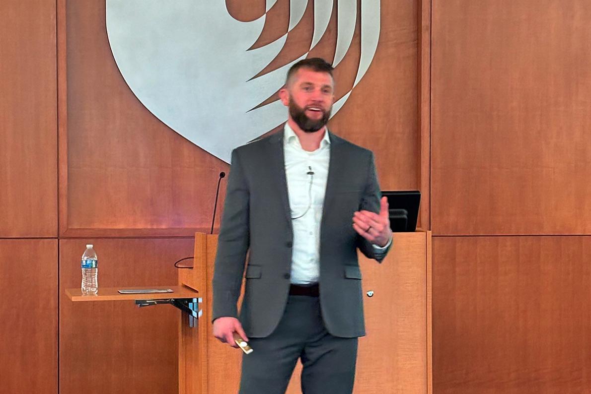 Dr. Grooms talking at the front of the IPE lecture hall