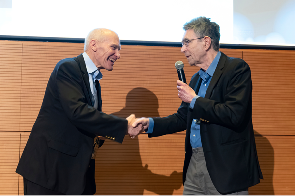 Carl June, MD being greeted by Robert Lefkowitz, MD at the 2025 Robert Lefkowitz Distinguished Lecture