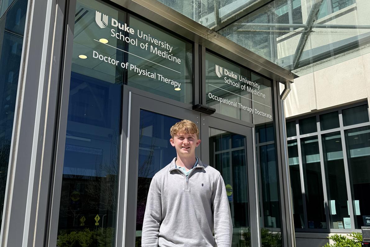 Matthew posing in front of Duke's IPE building