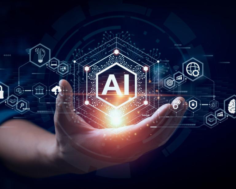 Illustration of a hand holding an illuminated AI logo