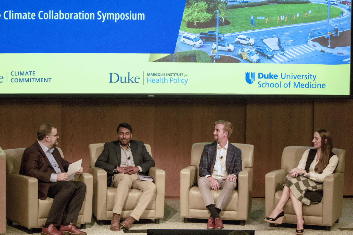 4 seated panelists attending the Duke Climate Collaboration Symposium. Robert Tighe, MD, associate professor of medicine and director of the School of Medicine’s Climate and Health Research Initiative, Nishad Jayasundara, PhD, Juli Plant Grainger Assistant Professor of Global Environmental Health, Stephen Colvill, MBA, assistant research director at the Duke-Margolis Institute for Health Policy,  Coral Giovacchini, MD, assistant professor of medicine, Photographs by Weiyee Mock 