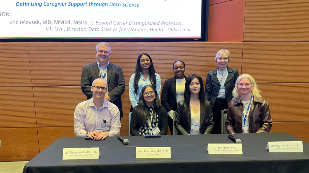 Panelists seated behind a table at the BIRCWH symposium.