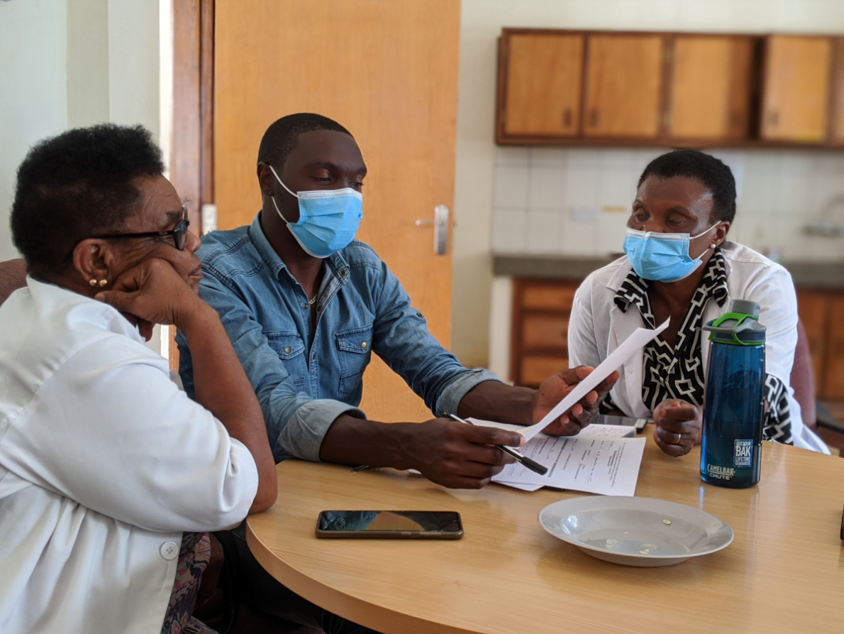 An alcohol intervention taking place at a kitchen table.