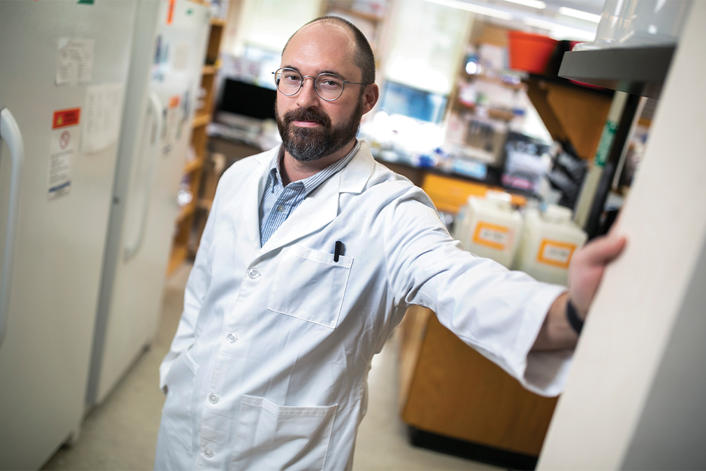 Nicholas Heaton, PhD, standing in his lab.