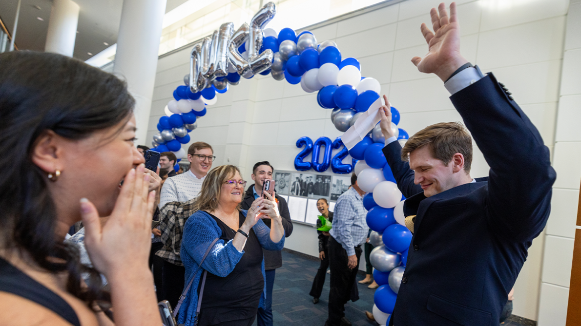 Michael Ivey (right) celebrates with friends and family after matching