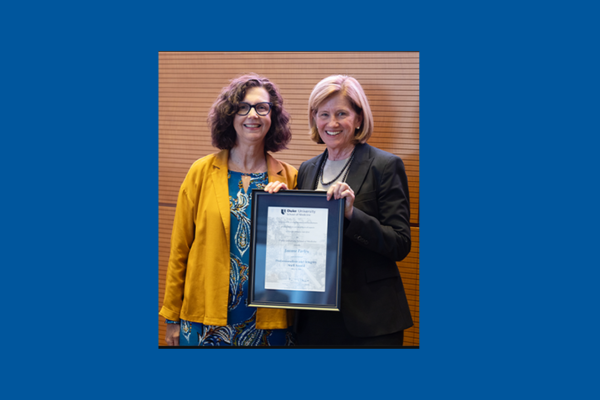 two females present award