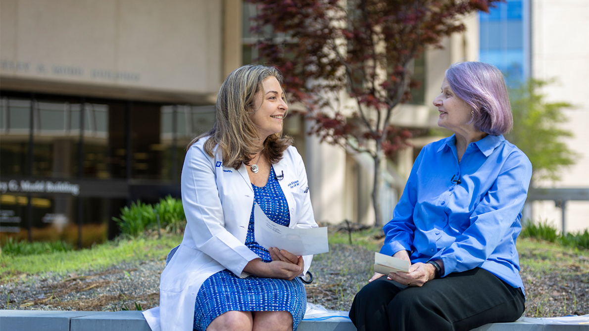 Heather Whitson, MD, MHS and Beth Humphrey sit together outside on Duke Campus