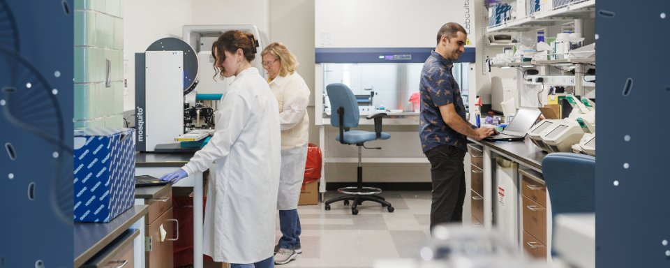 three scientist working in a lab