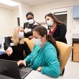Photo of Pickett Road staff talking