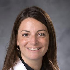 portrait of woman in white coat