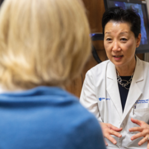 Dr. Hwang consulting with a patient