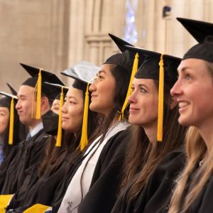 students at graduation in caps and gowns