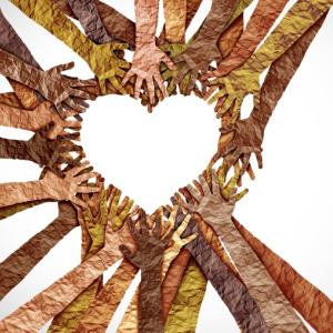 paper cutouts of hands and arms in different shades of skin tones reaching into a circle to make a heart shape