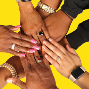 Men's and women's hands reaching into a center, some with rings and jewelry and painted nails, etc. 