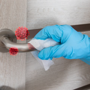 gloved hand wiping a door handle