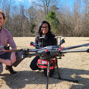 Two researchers with a Drone with an AED attached