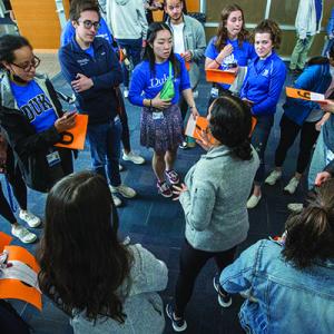 Rhea Dash instructs prospective students on how to work through a team learning exercise.