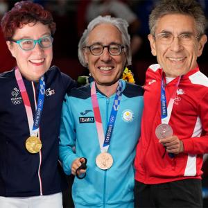 Drs. Tomasello, Moffitt, Caspi, Lefkowitz with their heads pasted onto the bodies of athletes in track suites wearing Olympic medals 