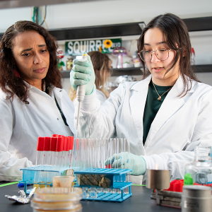 Asiya Gusa, PhD in her lab with a student