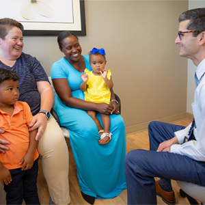 Clayton Alphonso, MD, with a family.