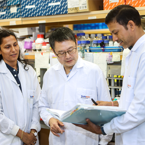 Paul Yen, PhD in the lab with his associates