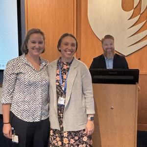 three professors at the front of the room