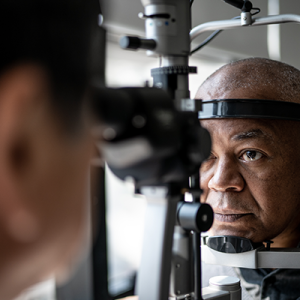 Black male patient receiving an eye exam