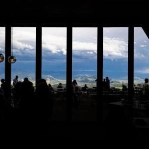 inside of a conference room with windows facing a mountain view
