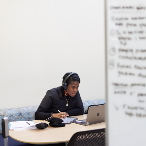 student on her computer in the Medical Center Library.