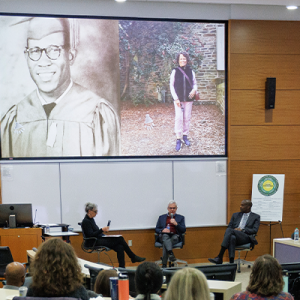 Jeffrey Baker, Damon Tweedy, and producer Beverley Abel speak about the podcast in a lecture hall