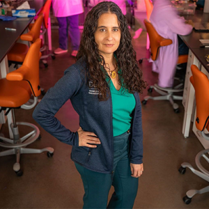 Portrait of Tatiana Segura in a busy lab