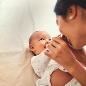 baby and mother looking at each other