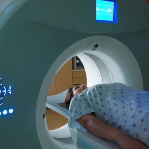 Photo of a woman entering an MRI machine