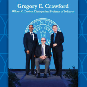 Gregory Crawford receiving award