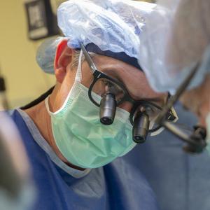 Pediatric heart surgeon Joseph Turek performing an operation